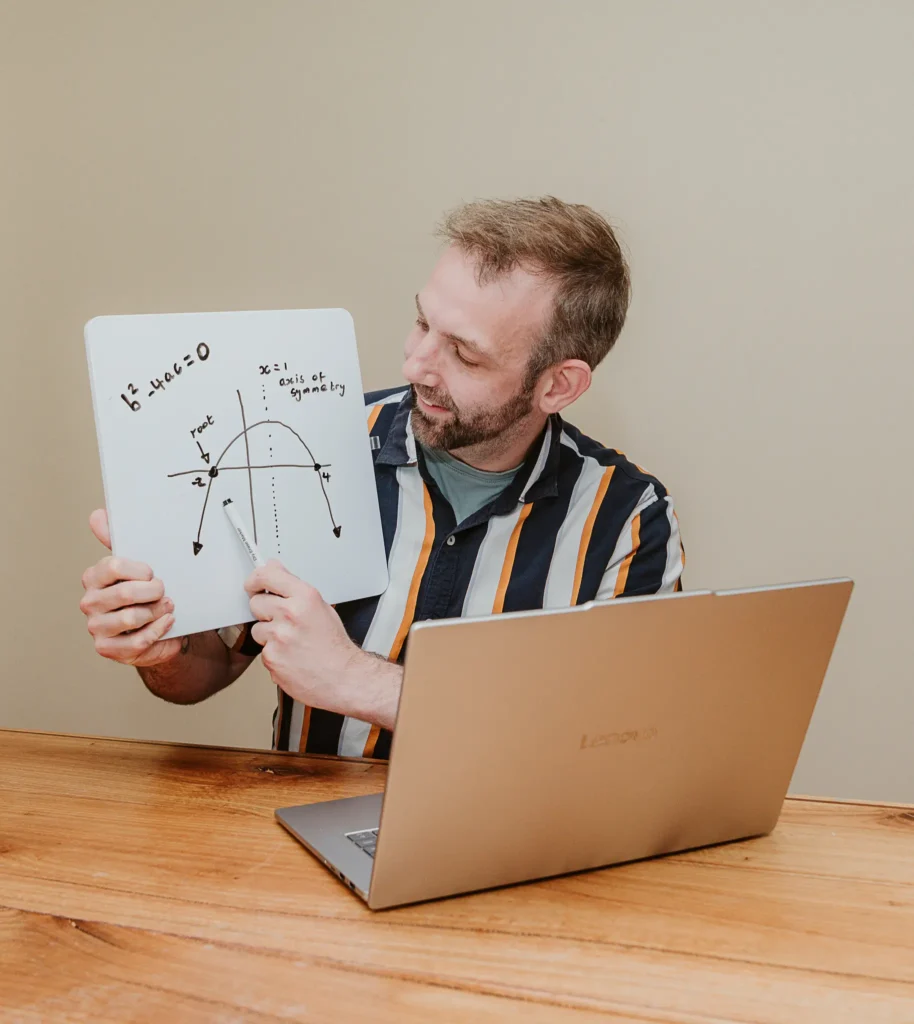 Daniel Collick from PeerPath explains a quadratic graph during an online maths lesson.